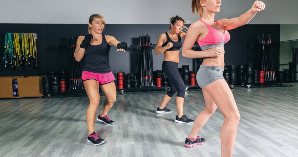 Women in a boxing class training punch